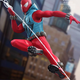Image for article titled How Is This Scarlet Spider Figure Meant to Eat This Donut?